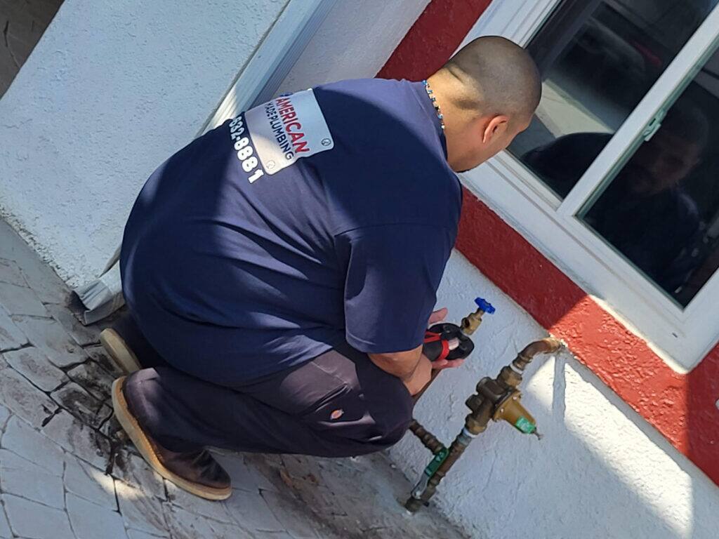 plumber fixing gas pipe