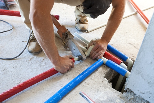 plumber repairing pipe